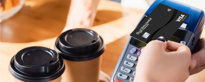 Customer paying for two coffee's with their US AllianceVisa Signature Credit Card